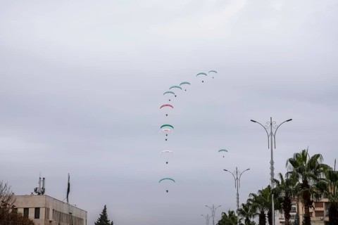 Damascus, Syria â€“ December 08, 2025: Paragliders display the Syrian flag during the first