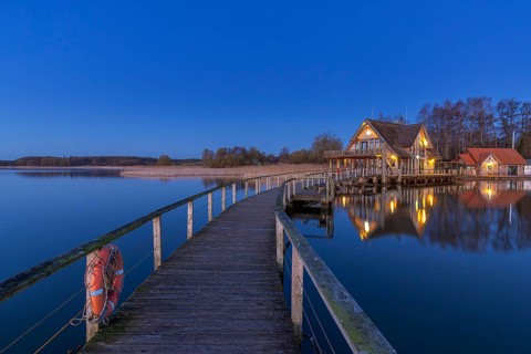 Lakehouse Â°54, bistro and bar on Lake Hemmelsdorf / Hemmelsdorfer See at sunrise in spring near