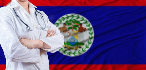 Doctor with crossed arms on Belize flag. Belizean health and care concept. Female doctor on Belize