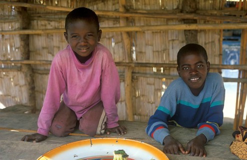 Two boys work at a market in Kande on Lake Malawi, Malawi, Africa, July 2000, vintage, retro, old,