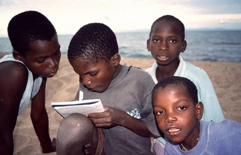 Local boys write down their addresses, Chitimba, Lake Malawi, Malawi, Africa, July 2000, vintage,