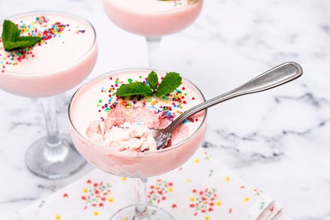 Fruit mousse, made from jelly and cottage cheese, in glasses, decorated with sprinkles and mint,