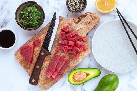 Cooking fresh tuna with ingredients on a marble countertop, ingredients for making sushi and tuna