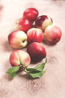 Nectarine scattered on the table, top view, close-up, no people