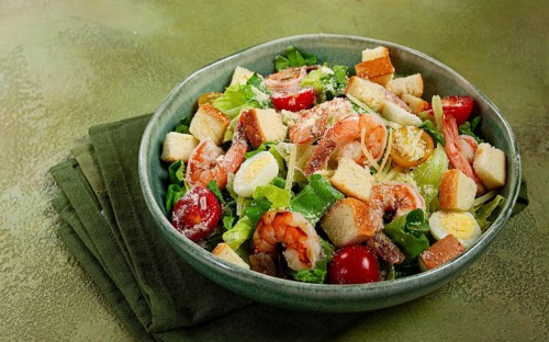 Caesar salad, with tiger prawns, shrimp salad, lettuce, quail eggs, cherry tomatoes, parmesan