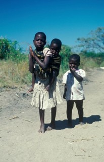 Girl with younger siblings near Kande Beach, Malawi, Africa, July 2000, vintage, retro, old,