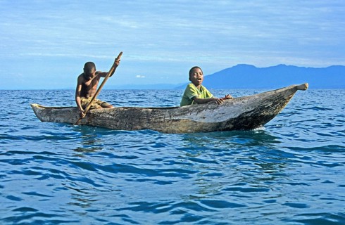 Two boys in a dugout on Lake Malawi, Malawi, Africa, July 2000, vintage, retro, old, historic