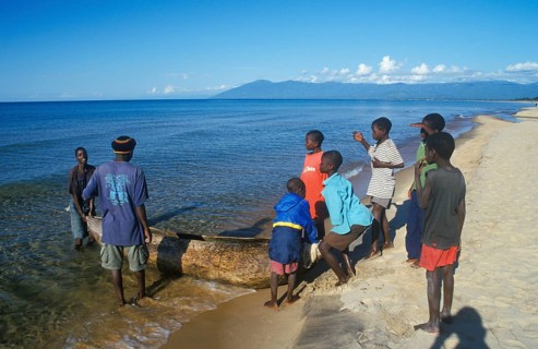 Local men and boys with a dugout near Kande Beach on Lake Malawi, Malawi, Africa, July 2000,