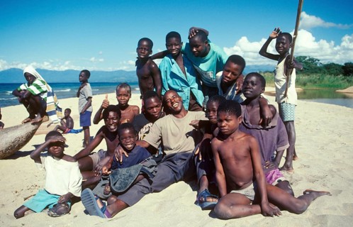 Boys and young men pose for a photo on Kande Beach on Lake Malawi, Malawi, Africa, July 2000,