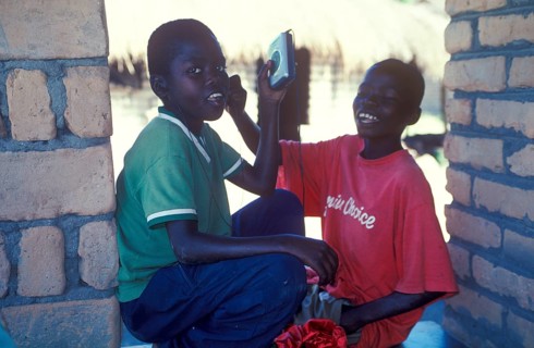 Two local boys with Walkman in a village near Kande, Lake Malawi, Malawi, Africa, July 2000,