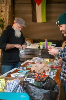 Detroit, Michigan - Volunteers with the Detroit Peoples Assembly put together whistle kits. The