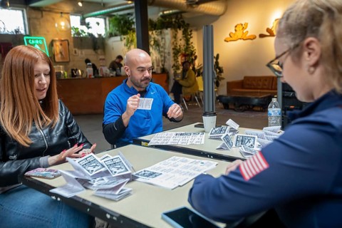 Detroit, Michigan - Volunteers with the Detroit Peoples Assembly put together whistle kits. The