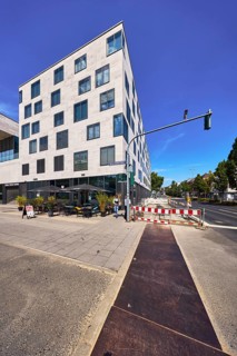 Commercial building, modern architecture, outdoor area of a restaurant, waffle house, fenced