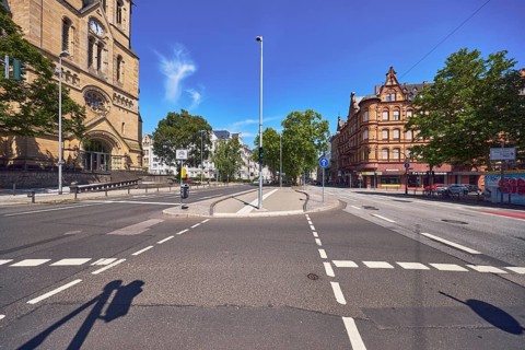 Street, general architecture, houses, church, traffic light intersection, central island, trees,