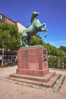 Orange monument, horse sculpture, trees, general architecture, blue sky, cirrus clouds,