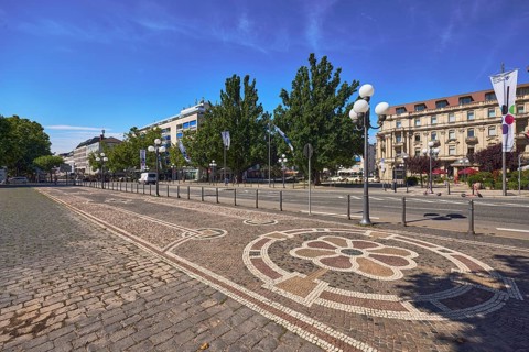 Sidewalk, paving stones, mosaic, pattern, barrier bollard, lantern, general architecture, trees,