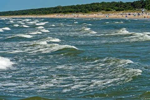 Play of Baltic Sea waves on the beach of the seaside resort of Ahlbeck, Usedom island,