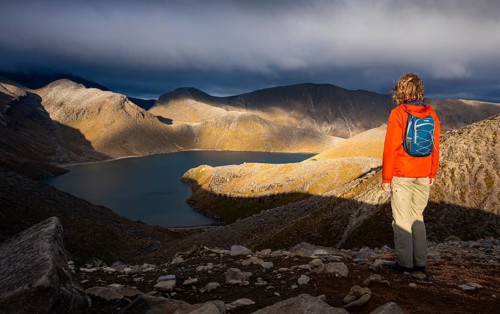 Hiker at Upper Tama Lake, Tama Lake Walk (Tama Lakes Track), evening light, golden hour, Tongariro
