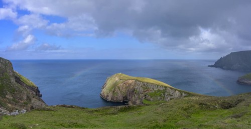 Rainbow over the blue sea and cliffs, Portacloy loop cliff walk, Muingnabo, County Mayo, Ireland