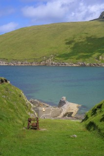 Rusted winch above small harbour, Portacloy loop cliff walk, Muingnabo, County Mayo, Ireland