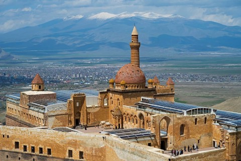 A historic palace with dome, overlooking a city and a mountainous landscape, Ishak Pasha Palace,