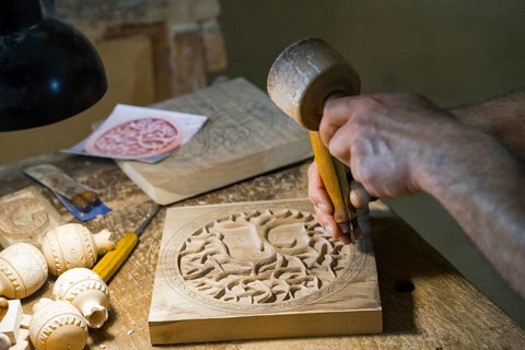Craftsmanship in a workshop where wood is carved and hand tools are visible, Old Town, Sharambeyan