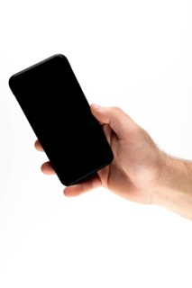 Hand holding a black smartphone against a white background