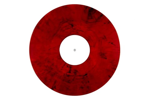 Red marbled vinyl record with a white label in the middle on a white background