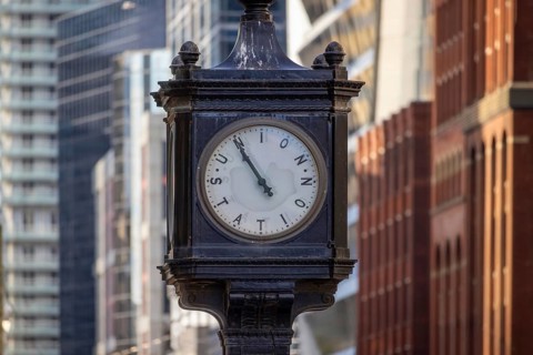 Toronto Union Station clock in front of Union Station, main city passenger transportation hub that