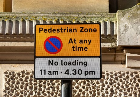 Pedestrian Zone access and loading restrictions sign in town centre of Ipswich, Suffolk, England,