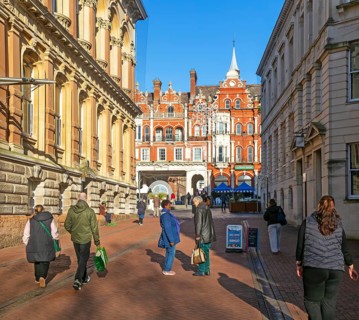 People walking chatting in pedestrianised area, Princes street, town centre of Ipswich, Suffolk,