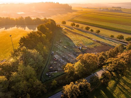 Wide landscape at sunrise, enlivened by autumn colors and soft light, PV Freifaechenanlage