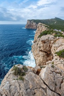 Steep cliffs by the sea, Belvedere Foradada, cliffs on the Capo Caccia headland, Alghero, Sardinia,