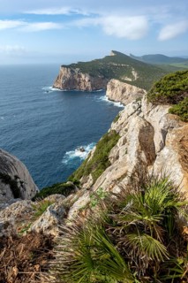 Steep cliffs by the sea, coastal landscape, cliffs on the Capo Caccia headland, Alghero, Sardinia,