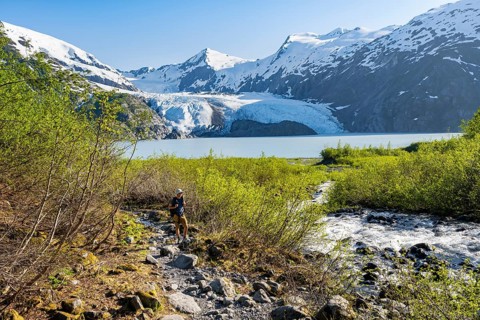 Hikers on the Portage Pass Trail, snowy mountains, Portage Glacier and Portage Lake, near Whittier,