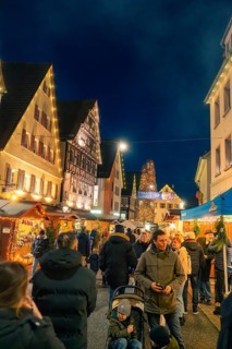 Evening Christmas market with illuminated half-timbered houses and festive atmosphere, Christmas