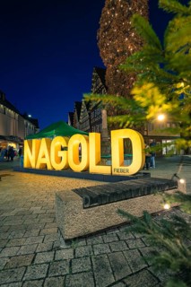 Glowing Nagold lettering and Christmas tree in the city center at night, Christmas market 2025,