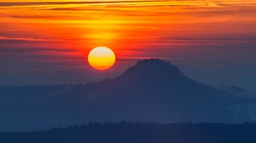 The distinctive silhouette of the Hohentwiel Hegau volcano at sunset, Konstanz district,