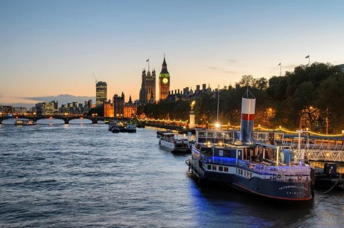 View over the Thames at golden hour with the Palace of Westminster and Elizabeth Tower, Big Ben, a