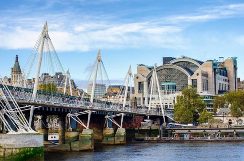 The Hungerford Bridge and Golden Jubilee Bridge across the Thames with Embankment Place, City of