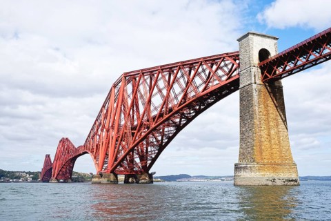 The 2467 meter long and 110 meter high Forth Railway Bridge between South Queensferry and North