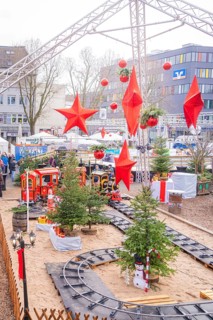 A festively decorated Christmas market with trees, trains and big red stars, Sindelfingen,