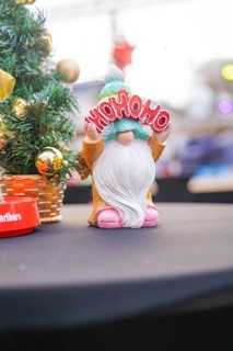 Happy dwarf holding 'Ho Ho Ho' sign against Christmas background, Sindelfingen, Böblingen district,