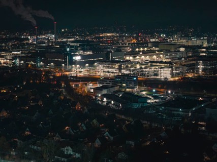 Industrial nocturnal cityscape with glowing buildings and factories, Sindelfingen, Böblingen