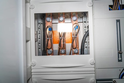 Close-up of a control box with detailed wiring and copper elements, electrician, new building,
