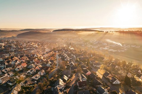 Sunrise over a village bathed in golden twilight shades, Gechingen, Hecken and GÃ¤u region, Calw