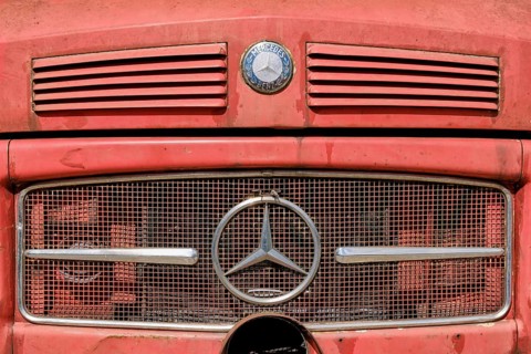 Close-up of a weathered Mercedes-Benz truck, classic car with logo, emblem, from the so-called