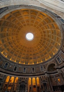 Isolated raindrops in the picture as white dots fall due to rotons in coffered ceiling with