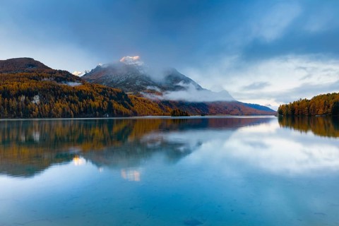 Clouds of fog over Lake Sils with Piz da la Margna in the background, Upper Engadin, Canton of