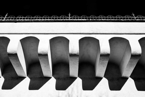 Architectural structures of a bridge with strong shadows in black and white photography, Radolfzell